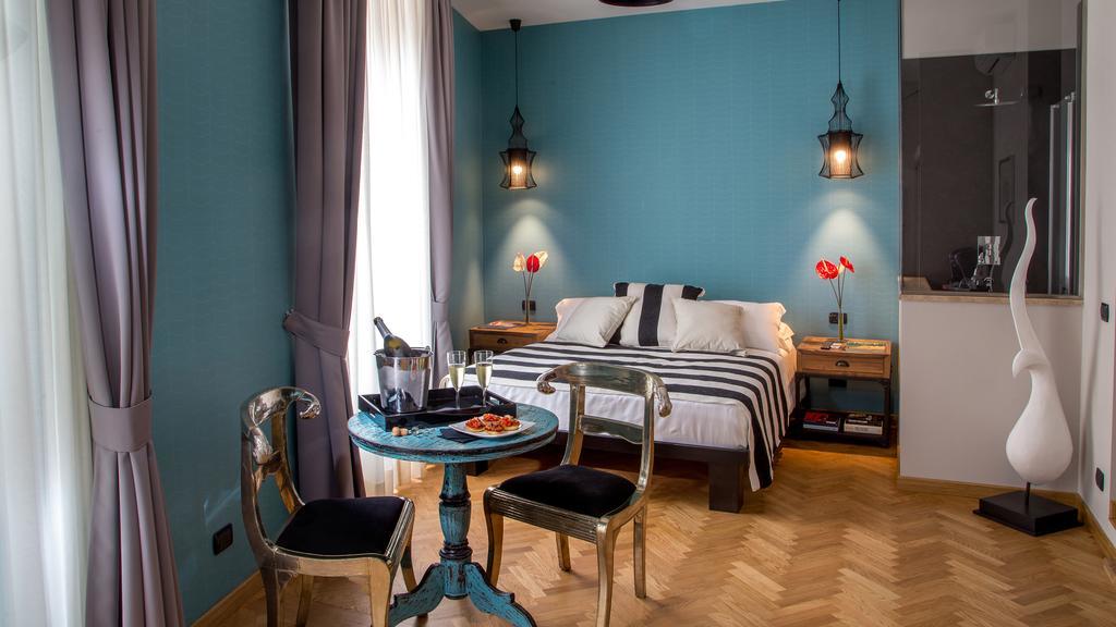 Qt Suites Roma Room photo
